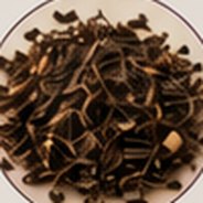 Loose black tea leaves.